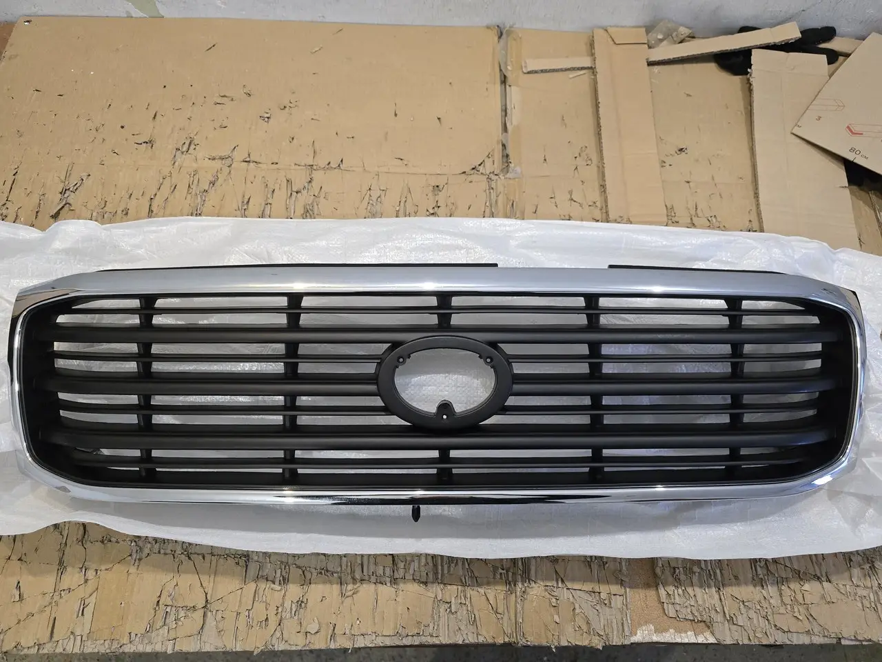 Решітка радіатора Toyota Land Cruiser 100 1998-2004 Дорестайлинг 5311160340